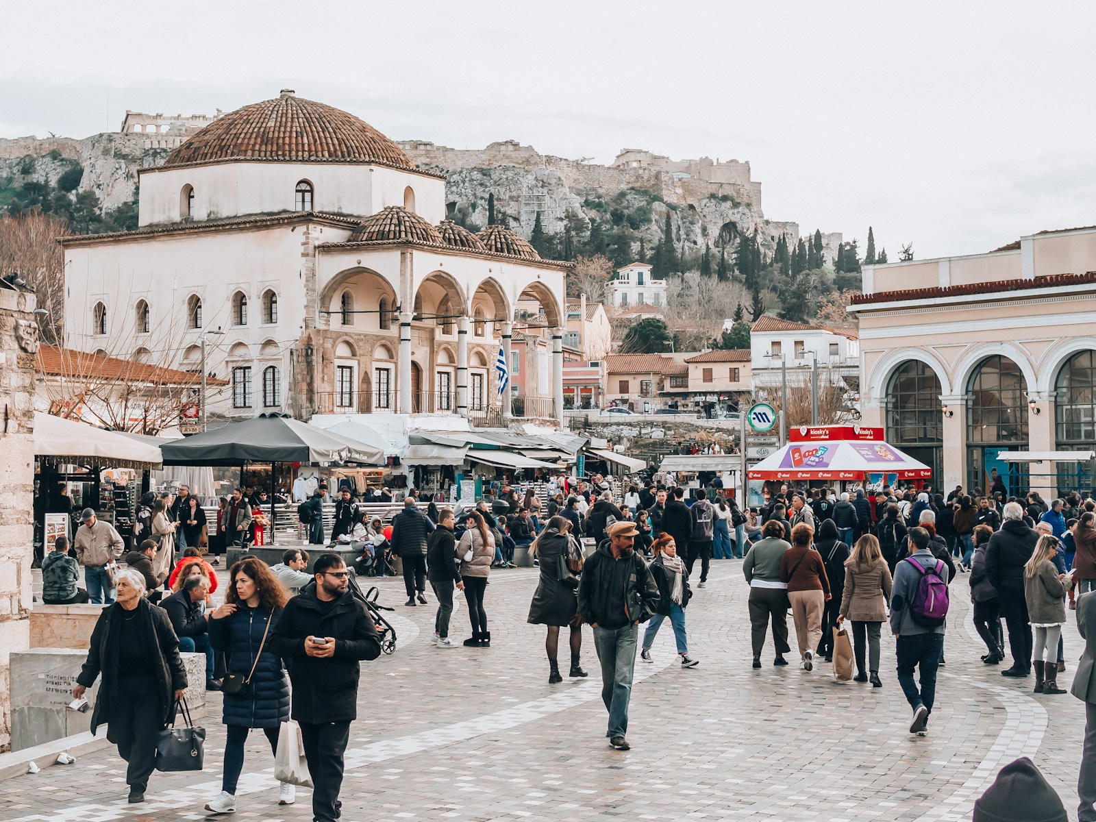 Monastiraki Square, with the mosque and the Acropolis behind the market